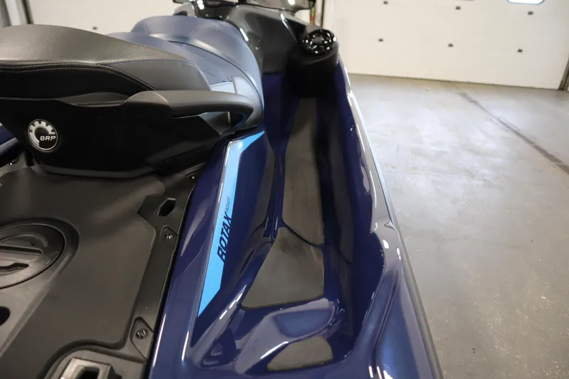Slide: The Image of 2025 Sea-Doo GTX™ 230 jet ski, blue and black, featuring BRP Rotax engine. - 10