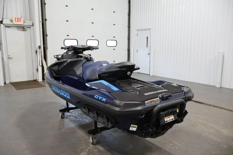 Slide: The Image of 2025 Sea-Doo GTX 230 jet ski in a garage. - 11