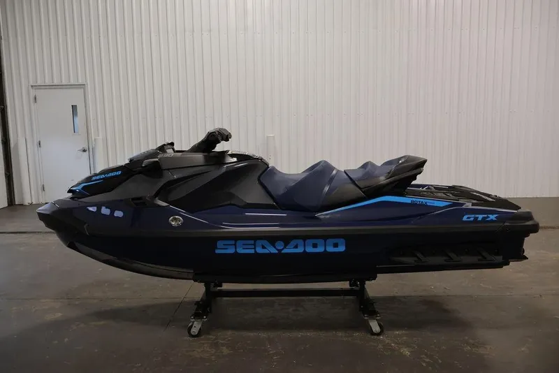 Slide: The Image of 2025 Sea-Doo GTX 230 jet ski in a warehouse. - 12