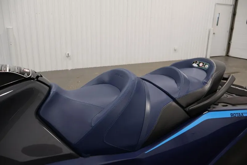 Slide: The Image of 2025 Sea-Doo GTX 230 jet ski seat in a garage. - 16