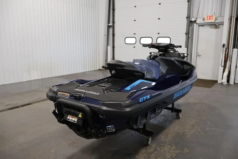 Slide: The Image of 2025 Sea-Doo GTX 230 jet ski in a garage. - 5