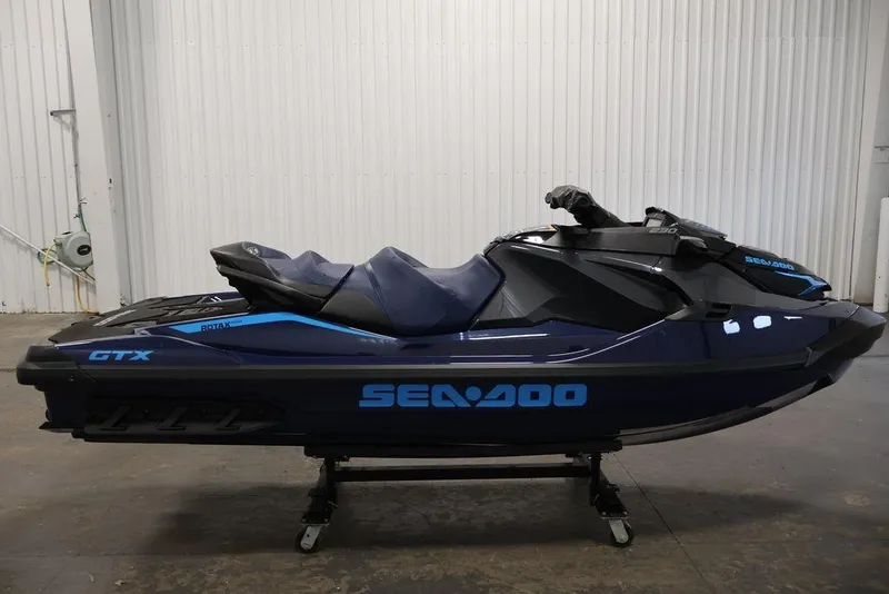 Slide: The Image of 2025 Sea-Doo GTX 230 jet ski in a garage. - 7