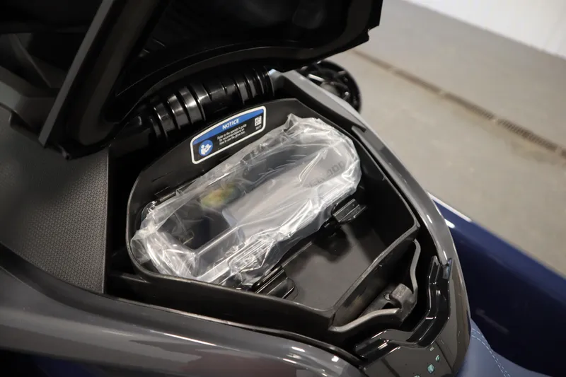 Slide: The Image of 2025 Sea-Doo GTX™ 170 storage compartment with protective cover, showcasing advanced features. - 7