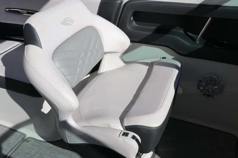 Slide: The Image of 2019 Chaparral 297 SSX boat seat with white and black upholstery. - 10