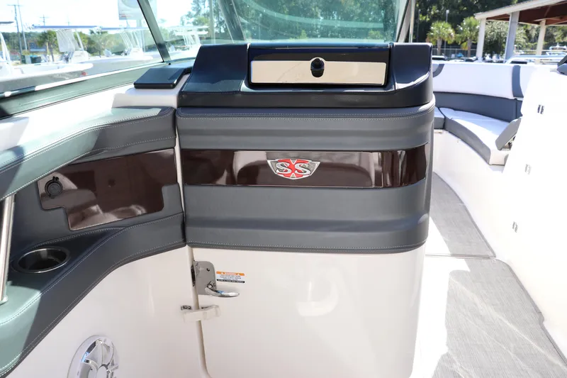 Slide: The Image of 2019 Chaparral 297 SSX boat interior with seating and dashboard details. - 13