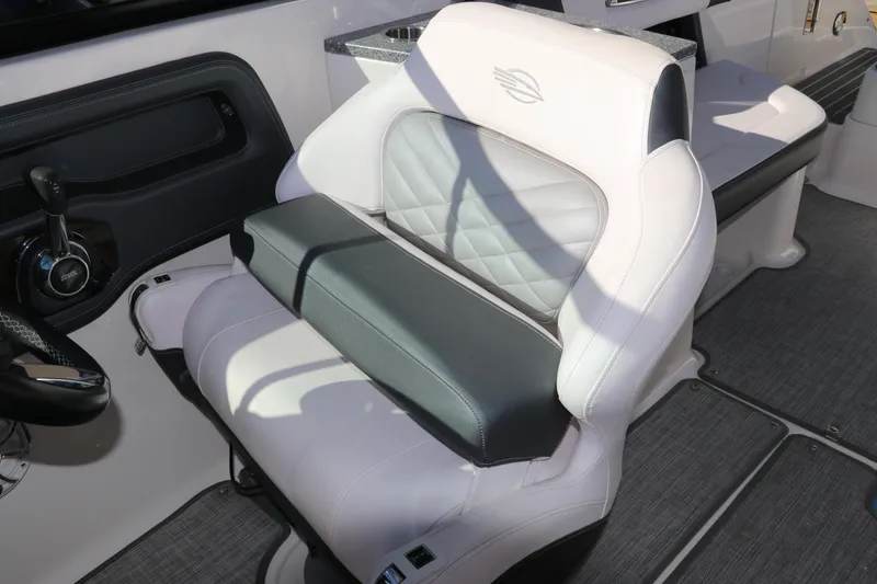 Slide: The Image of 2019 Chaparral 297 SSX boat interior with luxurious white and gray seating. - 15