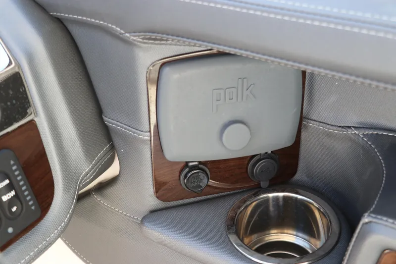 Slide: The Image of 2019 Chaparral 297 SSX interior with Polk audio system and cup holder. - 19
