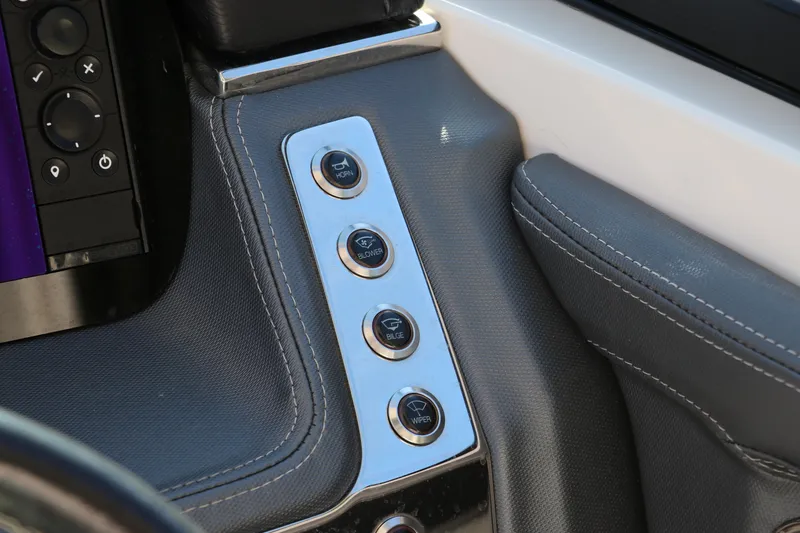 Slide: The Image of Close-up of 2019 Chaparral 297 SSX boat dashboard controls. - 23