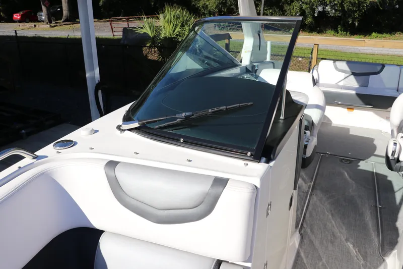 Slide: The Image of 2019 Chaparral 297 SSX boat interior with windshield and seating. - 26