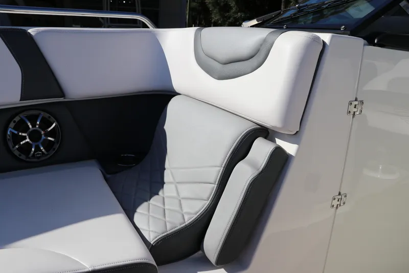 Slide: The Image of 2019 Chaparral 297 SSX boat interior with gray and white seating. - 27