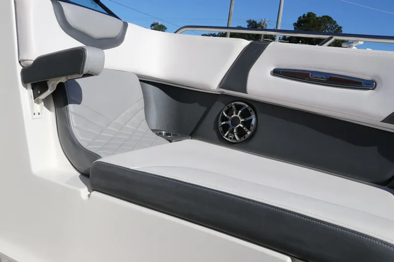 Slide: The Image of 2019 Chaparral 297 SSX boat interior with sleek seating and speaker detail. - 30