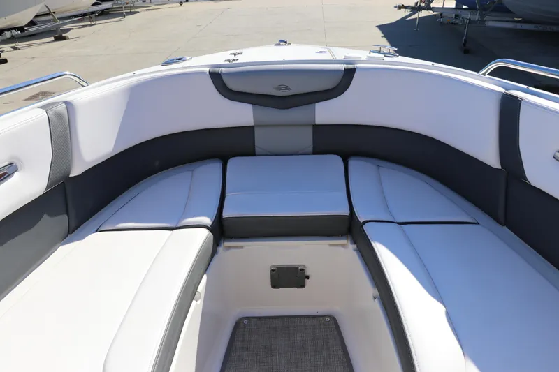 Slide: The Image of 2019 Chaparral 297 SSX boat interior with white and gray seating. - 31