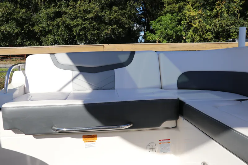 Slide: The Image of 2019 Chaparral 297 SSX boat interior seating with sleek design and comfortable upholstery. - 4