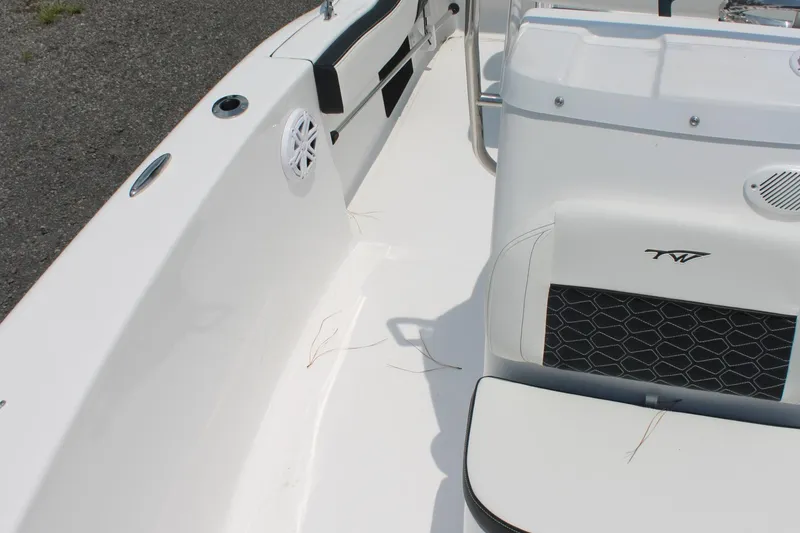 Slide: The Image of 2025 Tidewater 180 CC Adventure boat interior with seating and speaker detail. - 14
