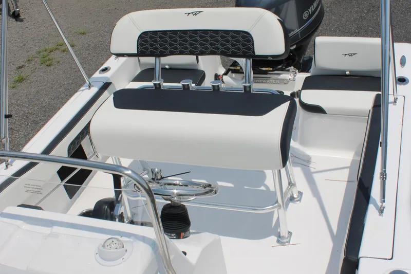 Slide: The Image of 2025 Tidewater 180 CC Adventure boat interior with seating and steering console. - 15