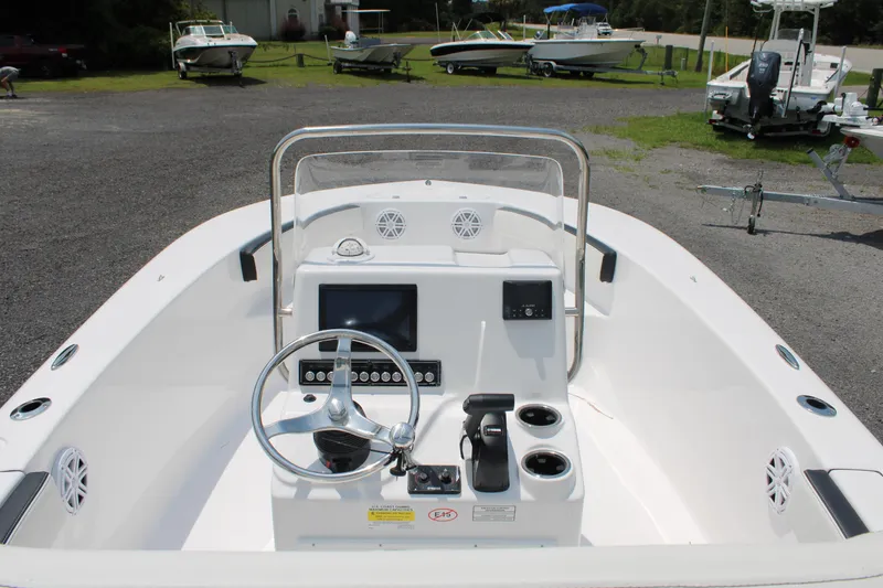 Slide: The Image of 2025 Tidewater 180 CC Adventure boat interior with steering console and controls. - 17