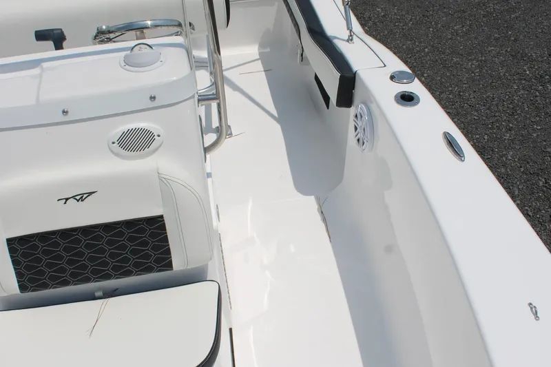 Slide: The Image of 2025 Tidewater 180 CC Adventure boat interior with seating and speaker. - 19