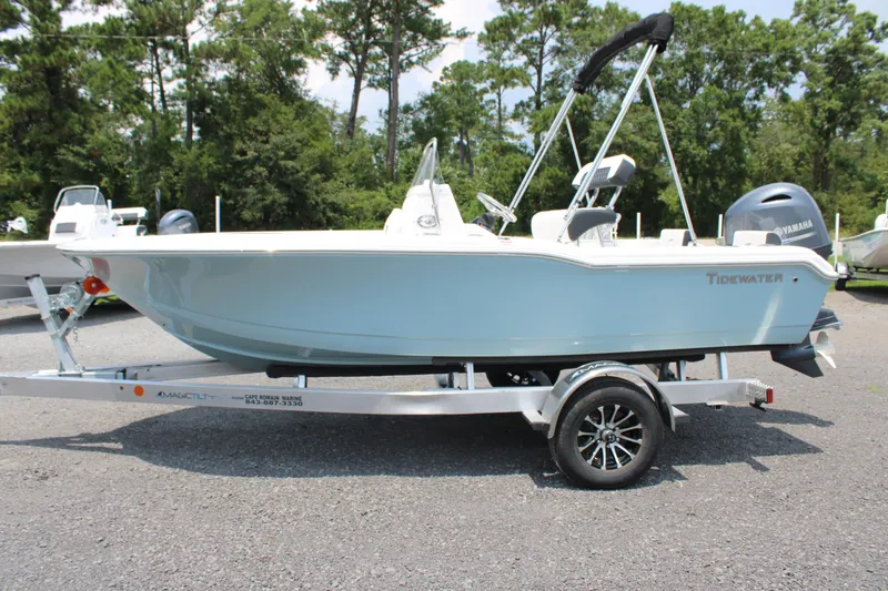 Slide: The Image of 2025 Tidewater 180 CC Adventure boat on trailer, parked outdoors. - 4