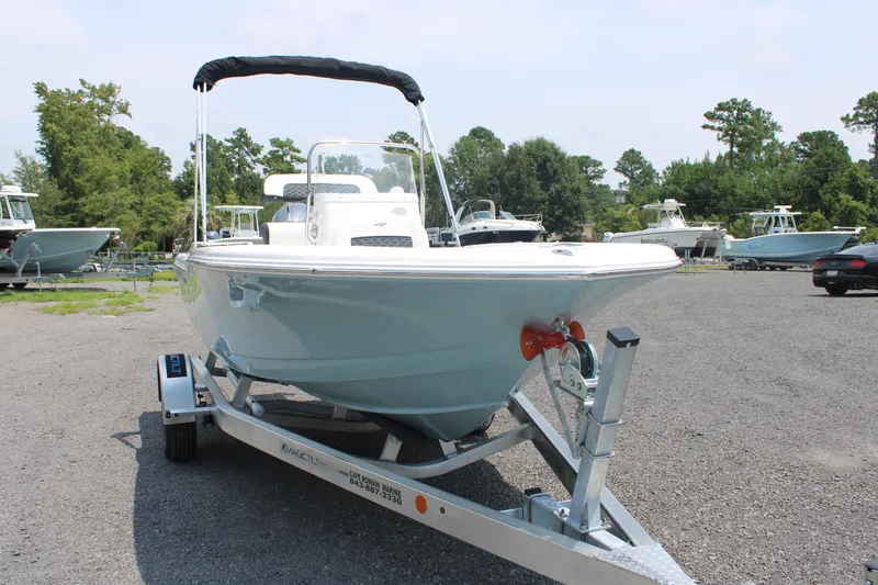 Slide: The Image of 2025 Tidewater 180 CC Adventure boat on trailer in outdoor setting. - 5