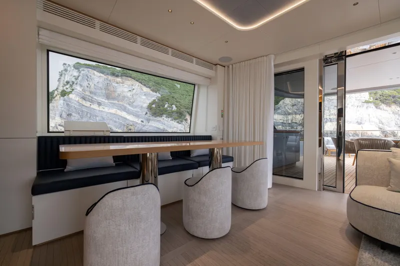 Slide: The Image of Luxurious interior of 2025 Benetti Oasis 34M yacht with scenic window view. - 23