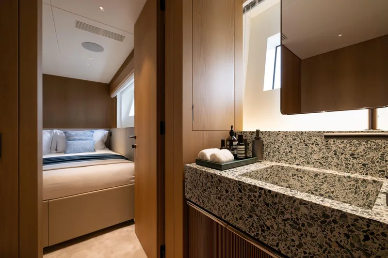 Slide: The Image of Luxurious interior of 2025 Benetti Oasis 34M yacht featuring elegant bedroom and modern bathroom. - 39