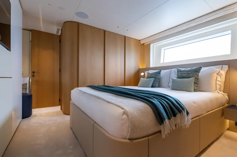 Slide: The Image of Luxurious bedroom on 2025 Benetti Oasis 34M yacht with modern decor and natural light. - 42