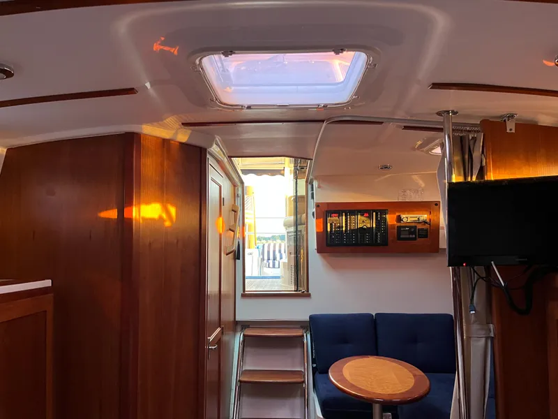 Slide: The Image of Interior of 2013 Back Cove 34 boat with cozy seating and wooden finishes. - 16