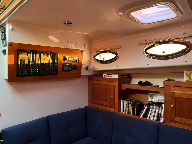 Slide: The Image of Interior of 2013 Back Cove 34 boat with cozy seating and wooden cabinetry. - 18