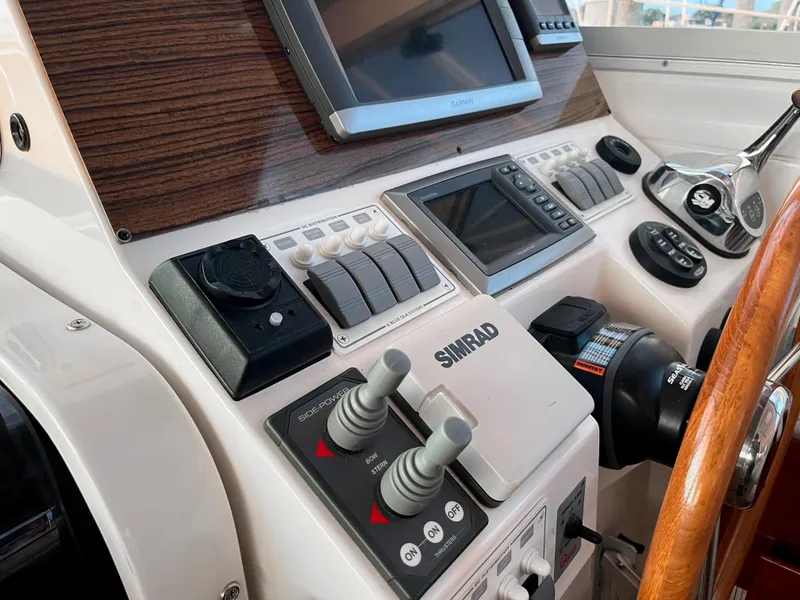 Slide: The Image of Control panel of a 2013 Back Cove 34 boat with navigation equipment. - 28