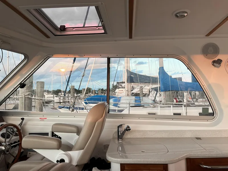 Slide: The Image of Interior view of 2013 Back Cove 34 yacht with marina backdrop. - 33