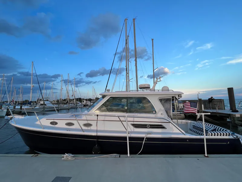 Slide: The Image of 2013 Back Cove 34 yacht docked at marina during sunset. - 7