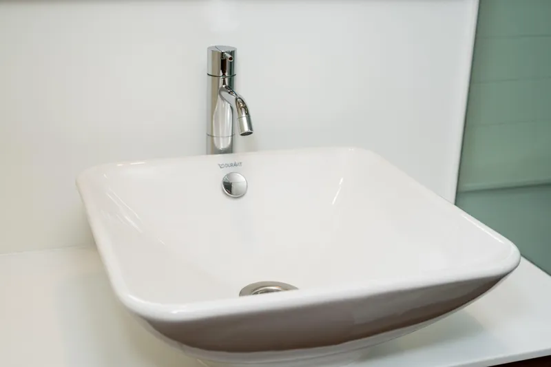 Slide: The Image of Modern white sink with chrome faucet on Delta Powerboats 54 IPS, 2017 model. - 37