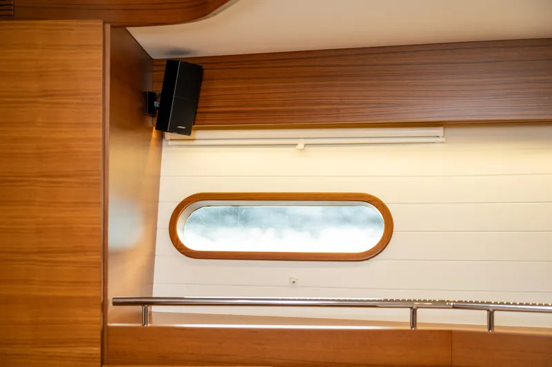 Slide: The Image of Interior of 2017 Delta Powerboats 54 IPS with wooden paneling and oval window. - 47