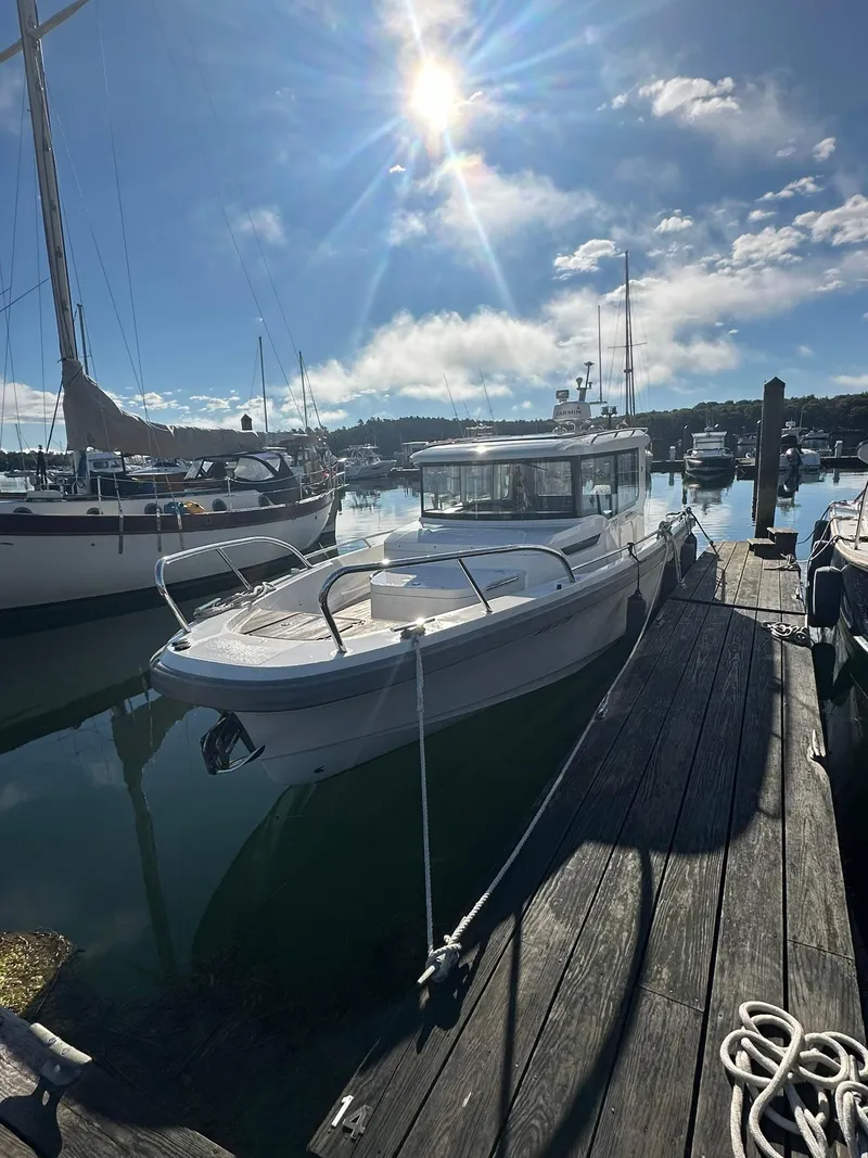 Slide: The Image of Nimbus C9 2021 boat docked in sunny marina with clear skies. - 0