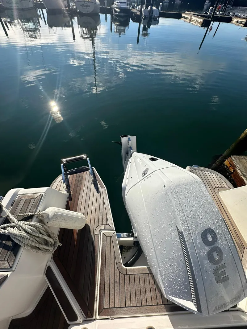 Slide: The Image of Nimbus C9 boat with outboard motor docked at marina, 2021 model. - 15