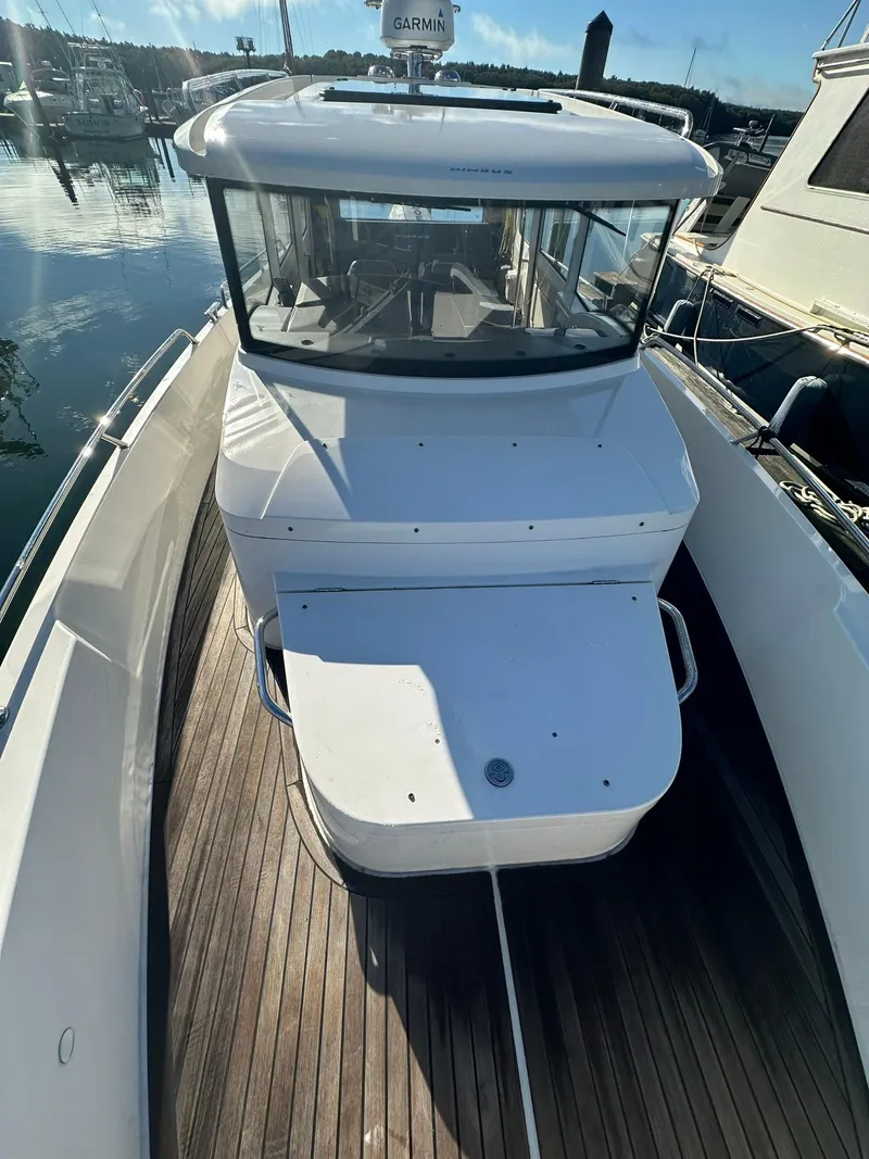 Slide: The Image of Nimbus C9 2021 boat with sleek design, docked at marina. - 17