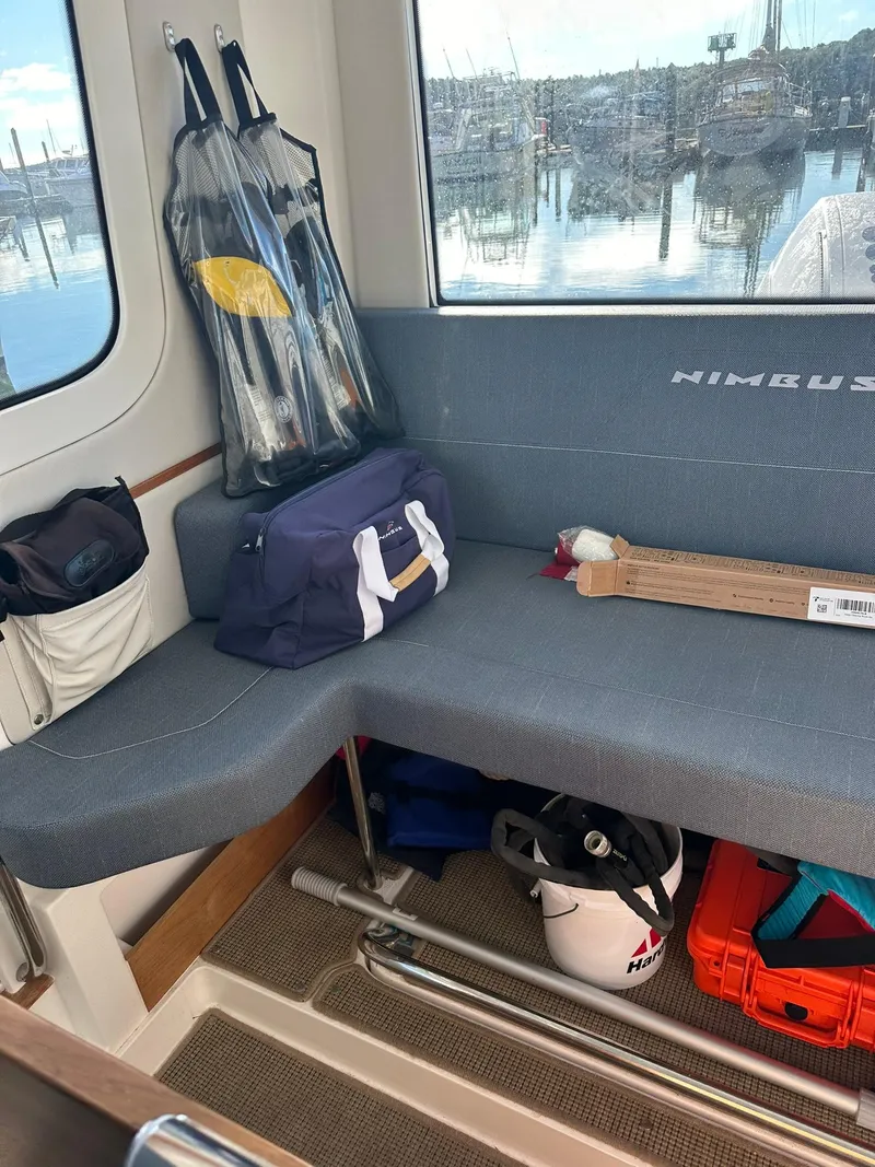 Slide: The Image of Interior of a 2021 Nimbus C9 boat with seating and storage. - 28