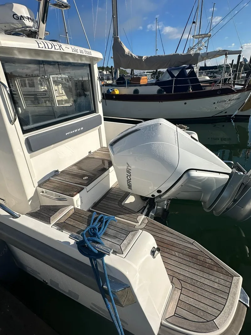 Slide: The Image of Nimbus C9 2021 boat with outboard motor docked in marina. - 4