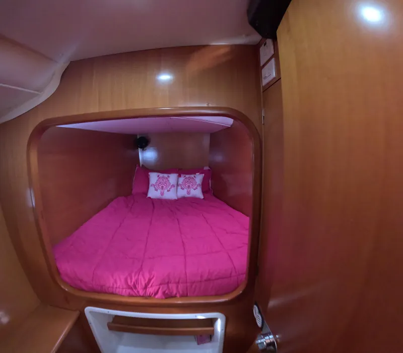 Slide: The Image of Cozy cabin with pink bedding in 2004 Lagoon 380 catamaran. - 14