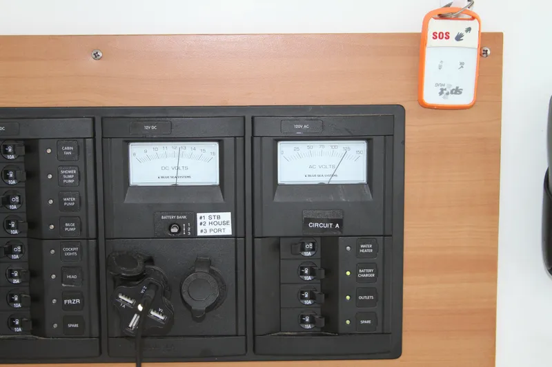 Slide: The Image of Electrical panel of a 2004 Lagoon LAGOON 380 catamaran with voltmeters and circuit breakers. - 27