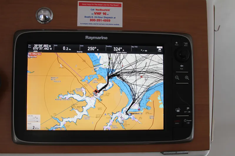 Slide: The Image of Raymarine navigation display on 2004 Lagoon 380, showing nautical chart and coordinates. - 30