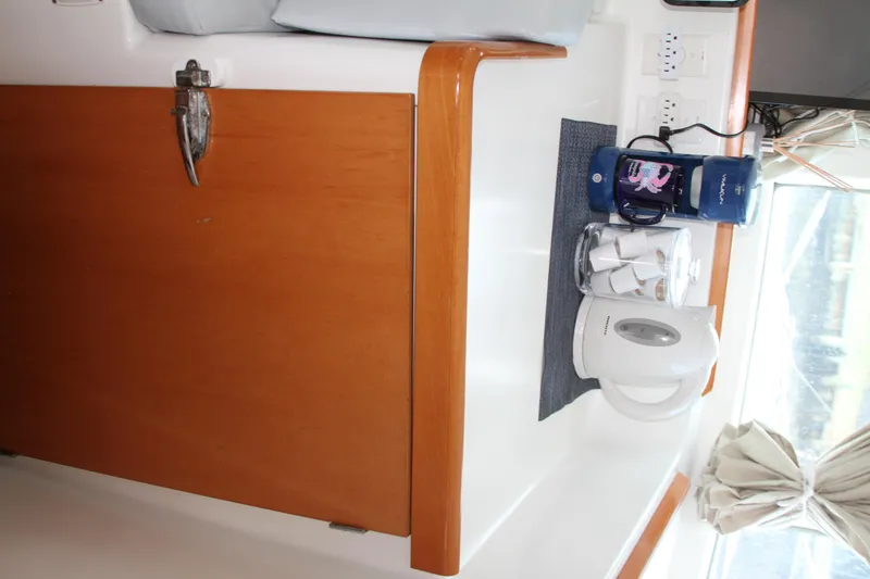 Slide: The Image of Interior of 2004 Lagoon 380 yacht with kettle and coffee maker on counter. - 35