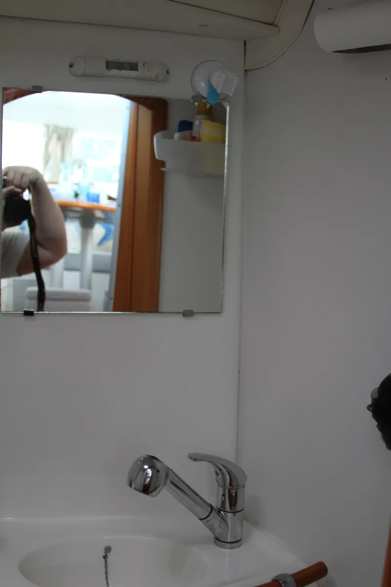 Slide: The Image of Bathroom sink and mirror inside 2004 Lagoon LAGOON 380 yacht. - 43