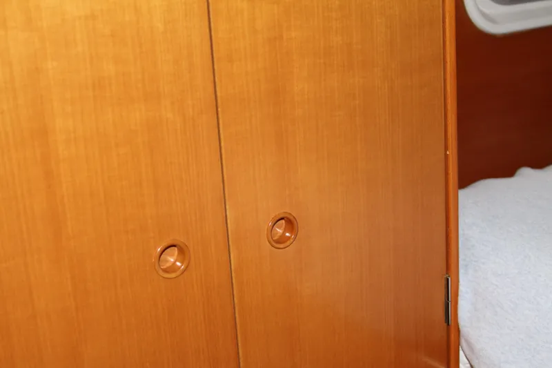 Slide: The Image of Wooden cabinet doors inside a 2004 Lagoon 380 catamaran yacht. - 46