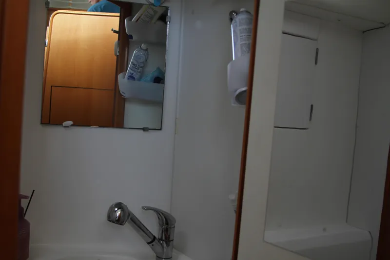 Slide: The Image of Bathroom interior of 2004 Lagoon 380 yacht with sink and mirror. - 47