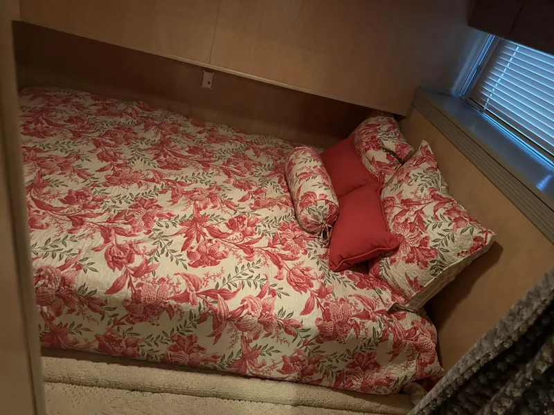 Slide: The Image of Cozy bedroom in 1999 Lakeview houseboat with floral bedding and natural light. - 14