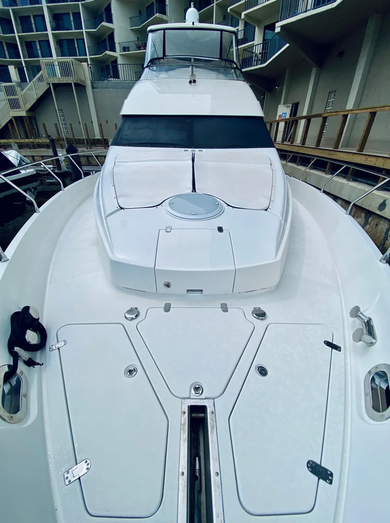 Slide: The Image of 2006 Marquis 59 yacht docked at marina, viewed from bow. - 15