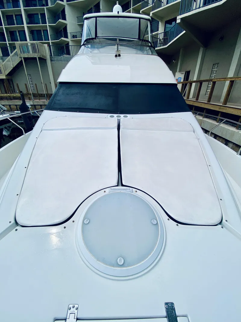 Slide: The Image of 2006 Marquis 59 yacht with sleek deck design and modern features. - 16