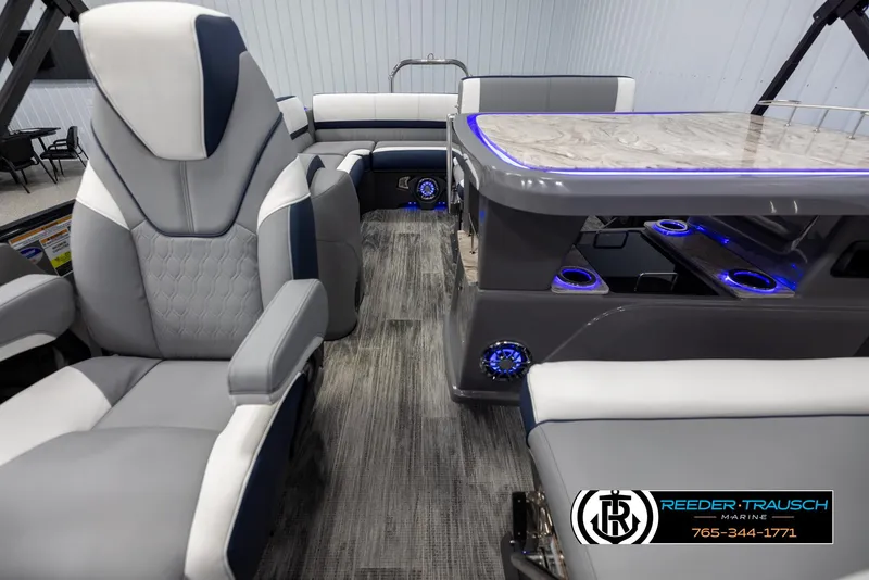 Slide: The Image of 2025 Avalon Catalina Entertainer interior with luxurious seating and illuminated table. - 14