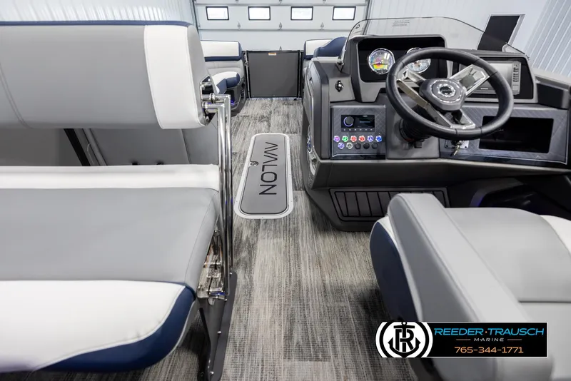 Slide: The Image of Interior of 2025 Avalon Catalina Entertainer boat with modern dashboard and seating. - 17